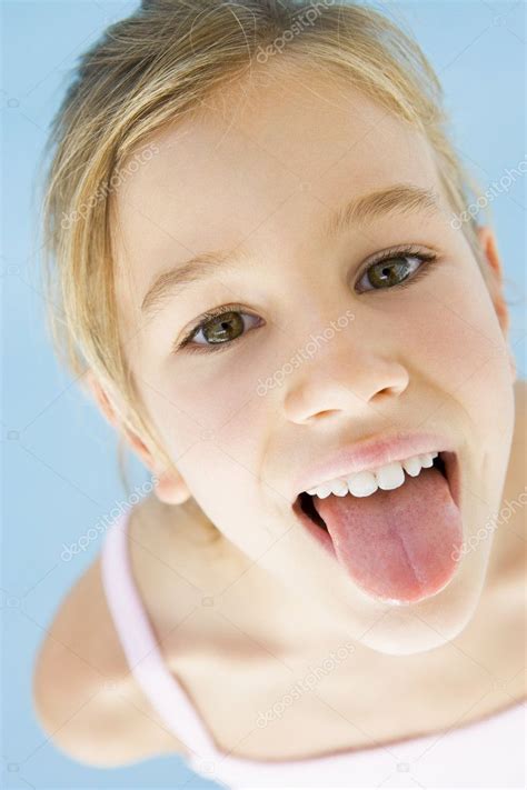 Young Girl Sticking Her Tongue Out Stock Photo by ©monkeybusiness 4781982