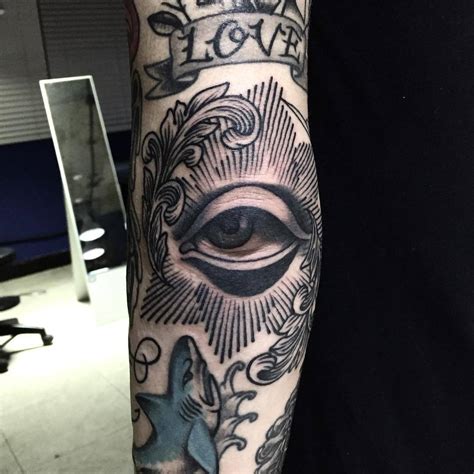 Eye tattoo on the elbow - Tattoogrid.net