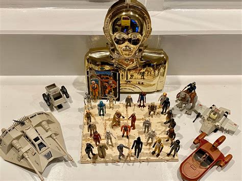 Set of Vintage Star Wars Action Figures, vehicles from 70s and 80s with C3PO carrier