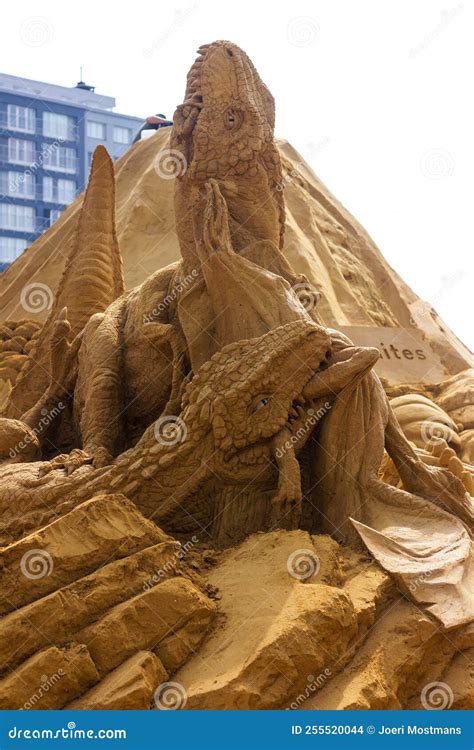 Middelkerke, Belgium - 23 July 2022: a Sand Sculpture of Two Carnivorous Dinosaurs Fighting Over ...