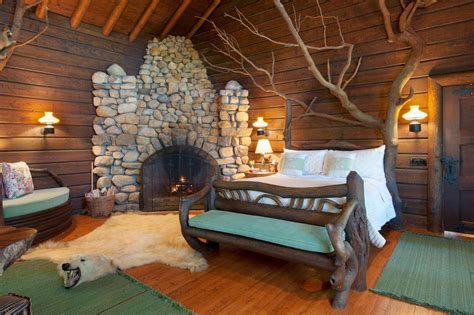 The "tree house" bedroom features a bed made from a tree | Tree house bedroom, Luxury villa ...