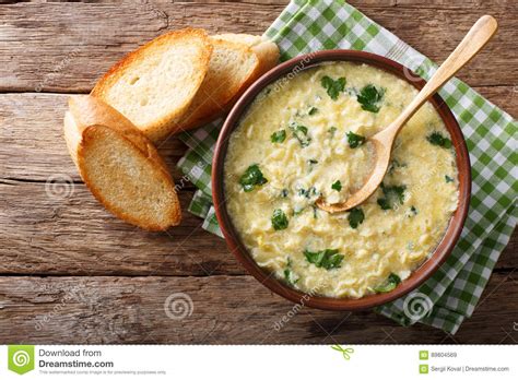 Italian Egg Soup Stracciatella with Farfalline Pasta and Parmesan Close-up. Horizontal Top View ...