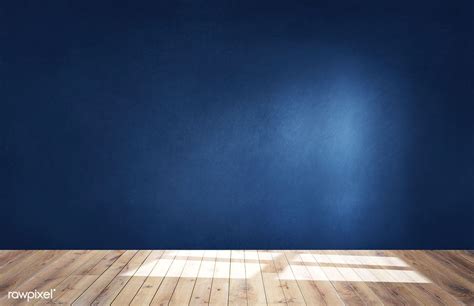 Dark blue wall in an empty room with a wooden floor | premium image by ...