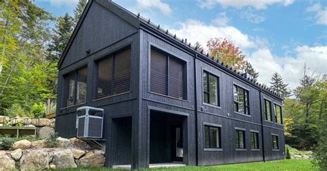 All Black Wood Siding Creates A Striking Exterior For This New House