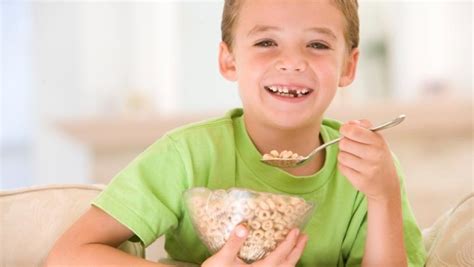 Group Of Kids Eating Cereal