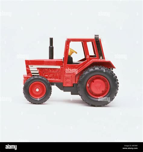 Red toy tractor Stock Photo - Alamy