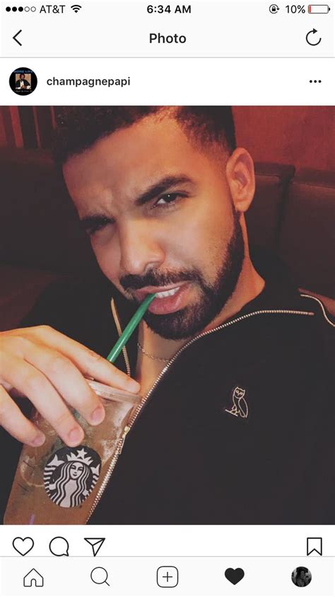 a man with a starbucks drink and a straw in his mouth