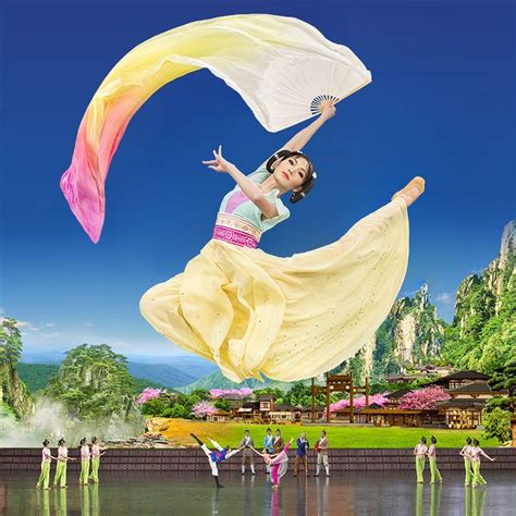 a woman is flying through the air while holding a white and yellow scarf over her head