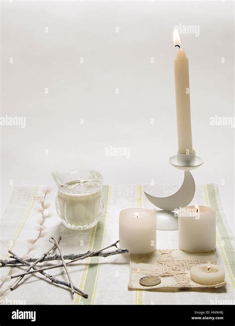 White wiccan altar with candles Stock Photo - Alamy