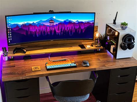 Warm 43 inch ultrawide setup with DIY IKEA KARLBY and ALEX desk | Remote Setups