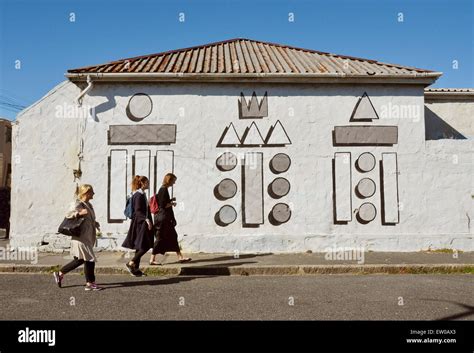 3 women passing street graffiti..Woodstock, Cape Town Stock Photo - Alamy