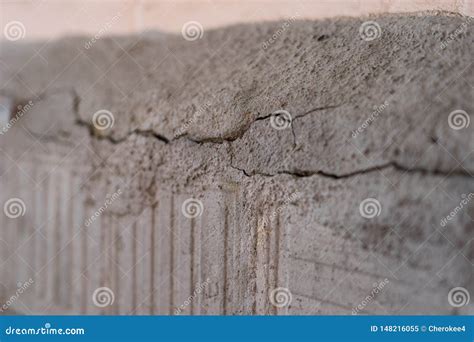 Old Foundation and Plaster Wall with Cracks. Building Requiring Repair Closeup. Stock Image ...