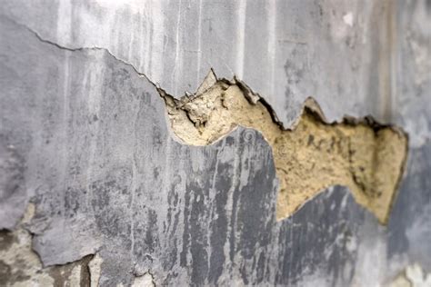 Old Foundation and Plaster Wall with Cracks. Building Requiring Repair Closeup. Stock Image ...