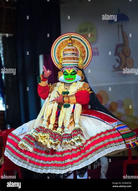 Dancer in traditional costumes perform the south Indian dance/drama of Kathakali in Kerala ...