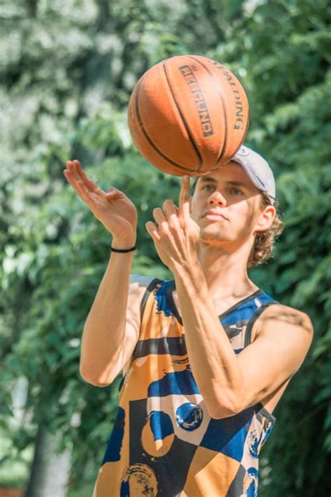 Man Spinning a Basketball Ball · Free Stock Photo