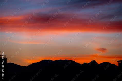 Sunset mountain peaks silhouette. Mountain sunset sky clouds Stock ...