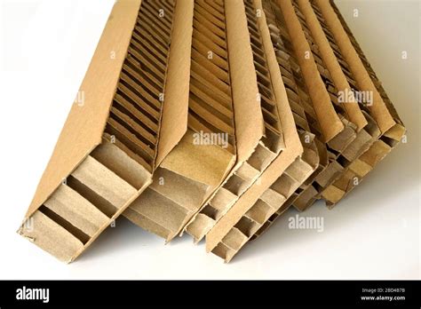 Sheets of brown corrugated cardboard used for filling in fragile parcels. Rigid double wall ...