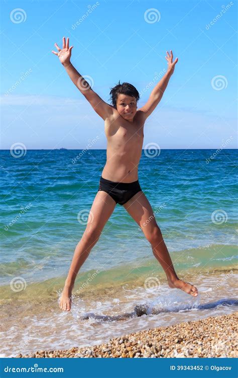 Happy Boy Jumping on the Beach Stock Photo - Image of holidays, clear: 39343452