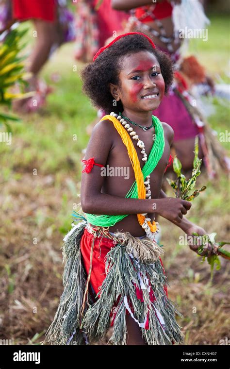 Indonesia, Papua New Guinea, Baluan Island. Young girl in traditional dress at dance performance ...