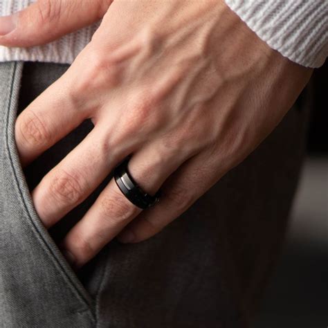 Men's Modern Wedding Ring - Men's black wedding ring. Designed with a carved black polished ...