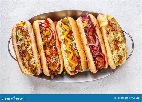 Hot Dogs Fully Loaded with Assorted Toppings on a Tray. Stock Image ...