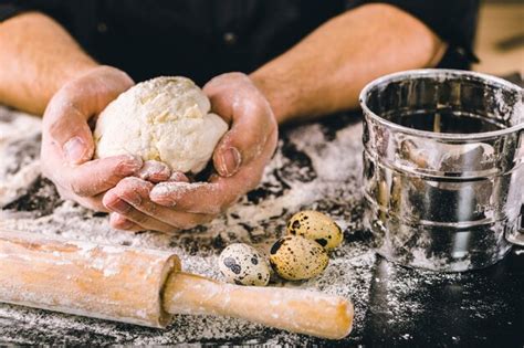 Premium Photo | Hands kneading a dough