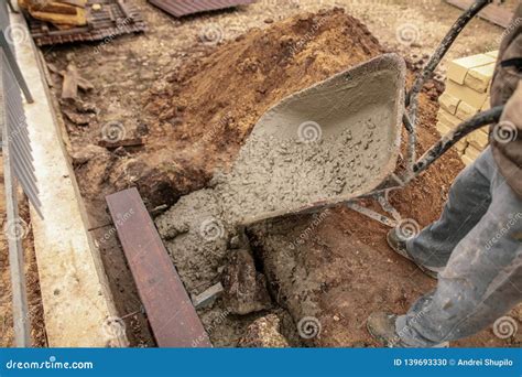 Concrete in a Wheelbarrow at a Construction Site Stock Photo - Image of ...