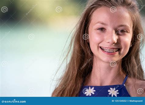 Teenage Girl Smiling with Braces Stock Photo - Image of dental, child: 125134552