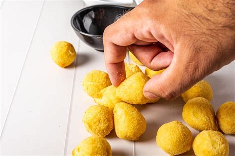 Premium Photo | Traditional fried coxinha over table, also some cheese ...