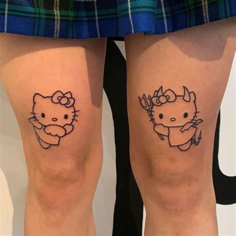 two hello kitty tattoos on both legs, one with an antelope and the other with a deer