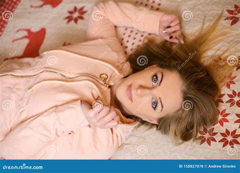 Beautiful Girl Lying On Her Back In Bed Royalty-Free Stock Image | CartoonDealer.com #158827078