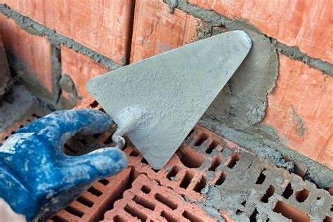 Premium Photo | Construction trowel for laying bricks and blocks construction tool of a ...