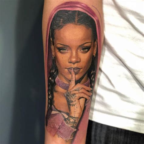 Rihanna portrait tattoo located on the inner forearm,