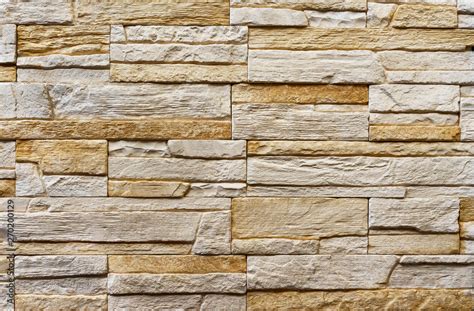 Texture of the stone wall. Panel of stones for finishing the facade of the building and interior ...