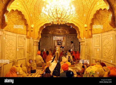 People sitting inside golden temple, amritsar, punjab, india, asia ...