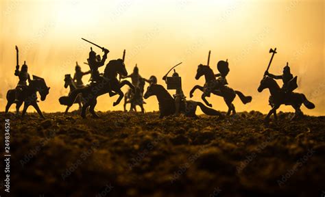 Medieval battle scene with cavalry and infantry. Silhouettes of figures as separate objects ...