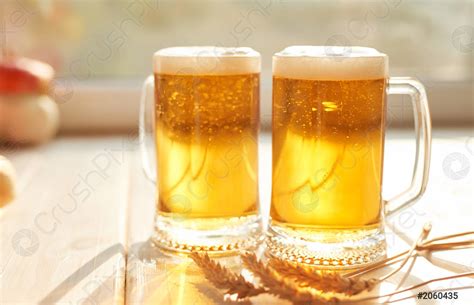 Oktoberfest beer Glass beer mugs full of golden lager with - stock photo 2060435 | Crushpixel