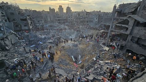 Israel-Gaza latest: Deadly strike on refugee camp 'targeted top Hamas commander'; more foreign ...