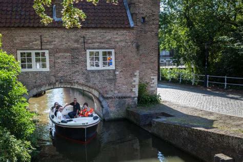 Delft: Open Boat Canal Cruise with Skipper | GetYourGuide