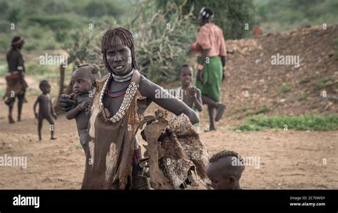 Omo Valley, Ethiopia - September 2017: Unidentified woman with her baby from the tribe of Hamar ...