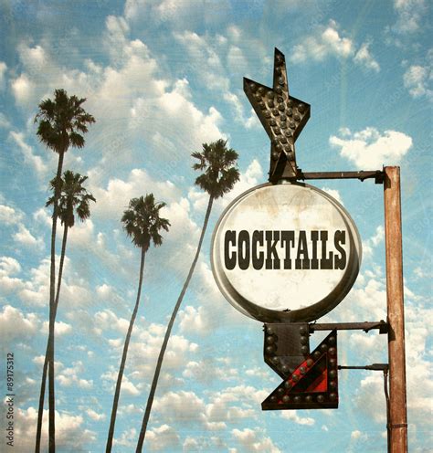 aged and worn vintage photo of cocktails sign and palm trees Stock Photo | Adobe Stock