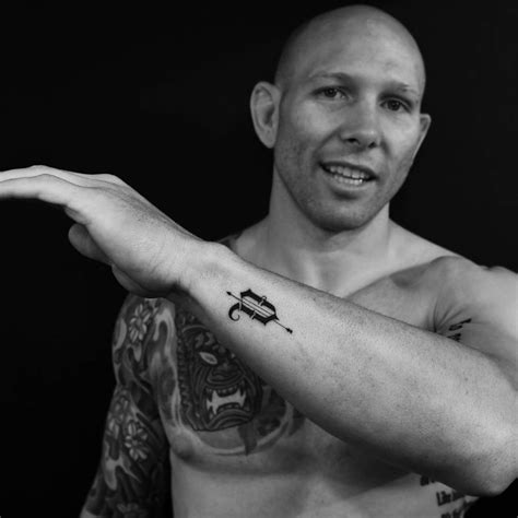 V letter tattoo on UFC fighter Josh Emmett.