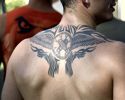 Tattoo In Gallery: tribal upper back tattoos for men