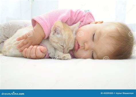 Baby And Cat Sleeping Together Stock Photo - Image: 45209305