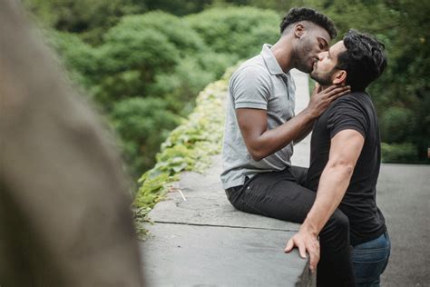 Two Men Kissing Outside · Free Stock Photo