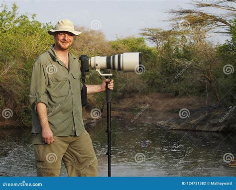 Wildlife Photographer with Long Lens on Camera in Africa Stock Photo - Image of photographer ...