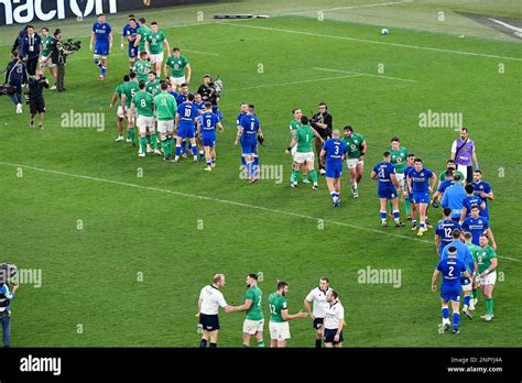 Players of Italy and Ireland greet each other at the end of the Six Nations rugby match between ...