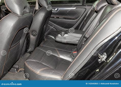 Interior View with Leather Seats and Opened Door of Black Used Volvo S60 Car Stands in the ...