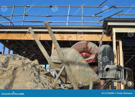 Concrete Mixer and Wheelbarrow Stock Photo - Image of scaffolds ...