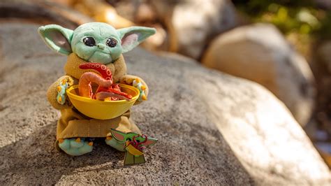 There's a New Collection of Baby Yoda Dolls & You're Going to Want Them All